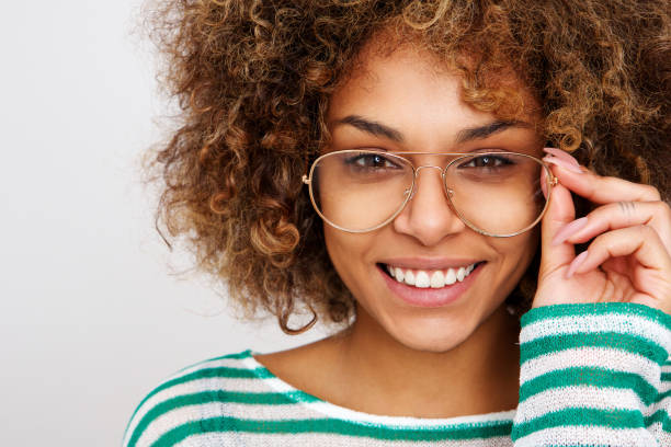 istock beautiful young black woman smiling with glasses 992138162