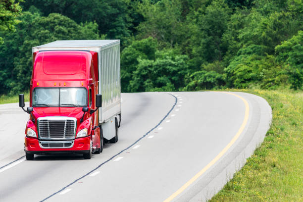 istock Red Semi Truck on Interstate With Copy Space. 992138694