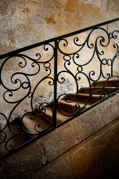 scala classica in una villa - staircase indoors wrought iron mansion foto e immagini stock