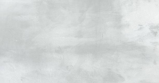 istock White washed painted textured abstract background with brush strokes in white and black shades. Abstract painting art backgrounds. Hand-painted texture. 992146036
