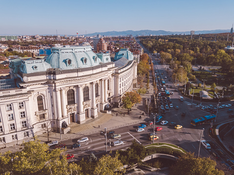 Klagenfurt, Austria – March 12, 2023: An outdoor scene with buildings, with a few parked cars in the foreground in Klagenfurt, Austria