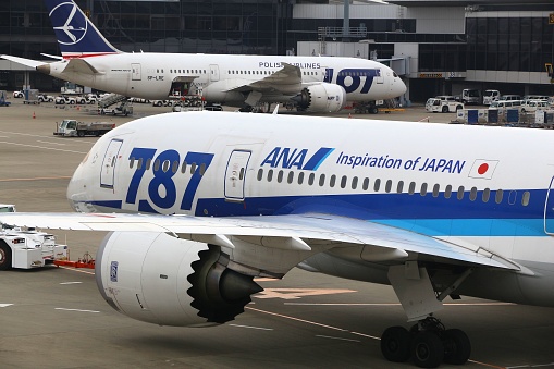 TOKYO, JAPAN - NOVEMBER 21, 2016: Boeing 787 Dreamliners at Narita Airport of Tokyo. The aircraft are operated by Air Nippon Airways (ANA) and LOT Polish Airlines.