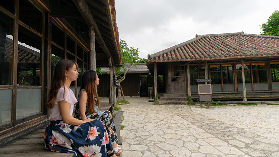 A woman is relaxing at an old-fashioned old private house in Nago in Okinawa Prefecture