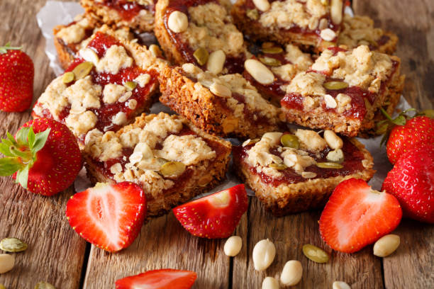 istock Granola bars with strawberry jam, seeds and nuts close-up. Horizontal 992166710