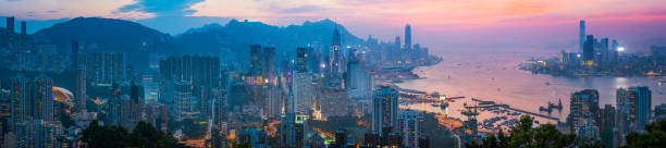 istock Hong Kong Harbour illuminated skyscraper cityscape at sunset panorama China 992183318