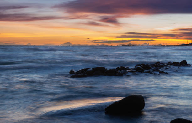 istock Seascape and rocks in sunset time. 992208394