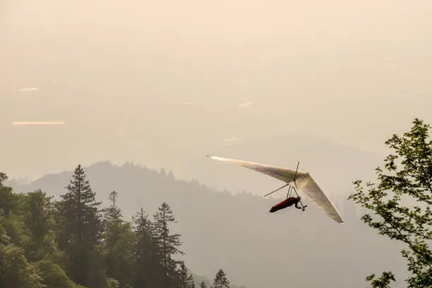 Hang glider enjoying adrenaline in the skies