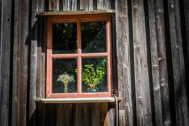 istock Window with old ceramic vase and wildflowers 992221228
