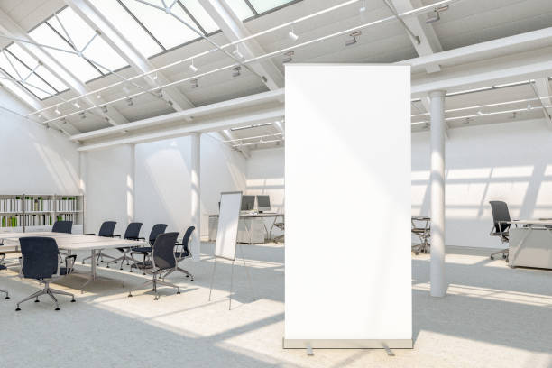 Blank roll up banner stands Blank roll up banner stand in loft office with clipping path around banner. 3d illustration rolling stock pictures, royalty-free photos & images