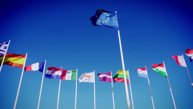Flags of EU and European countries against the blue sky