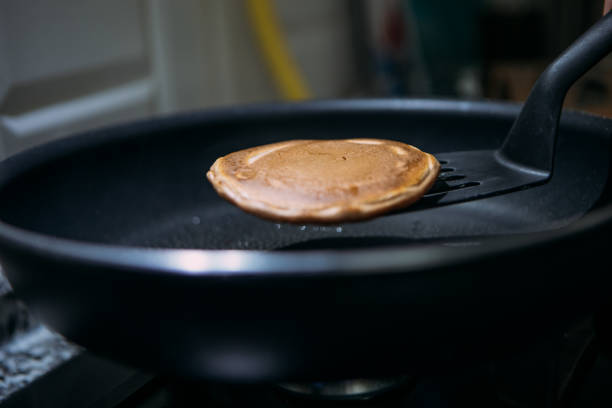 Rolled Pancake on a plate with a wedge of lemon.