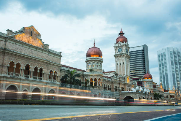 Sultan Abdul Samad Building with street traffic Sultan Abdul Samad Building with street traffic in Kuala Lumpur, Malaysia merdeka square stock pictures, royalty-free photos & images