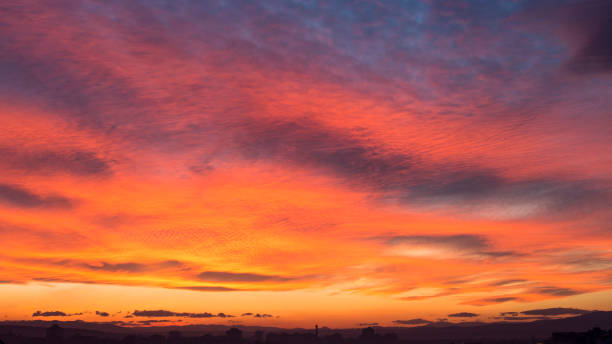 istock Vibrant Cloudscape at Sunset Over City 992287368