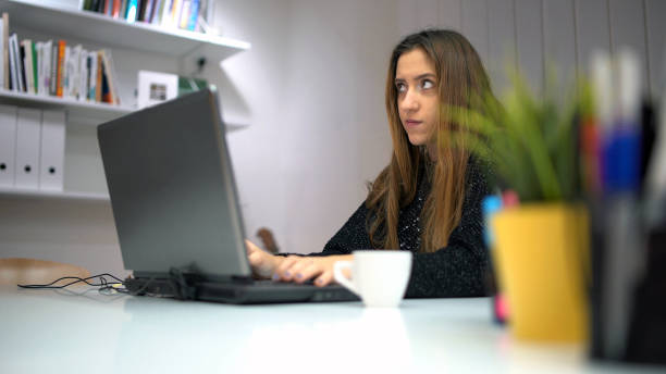 istock Tired Girl With Laptop in Office 992288000