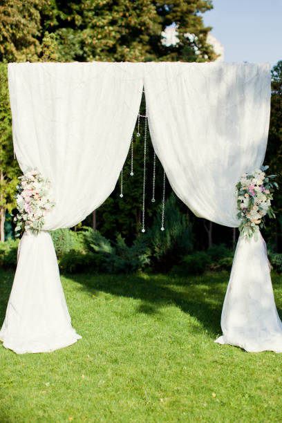 istock wedding arch with flowers and crystals 992290358