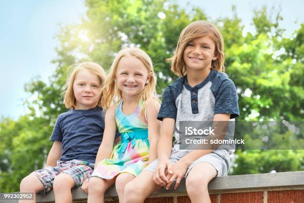 Brothers And Sister Outdoors Stock Photo - Download Image Now - Blond Hair, Boys, Brother