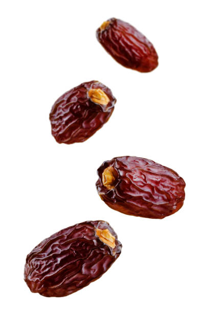 istock Four Flying Dates fruits isolated 992304118