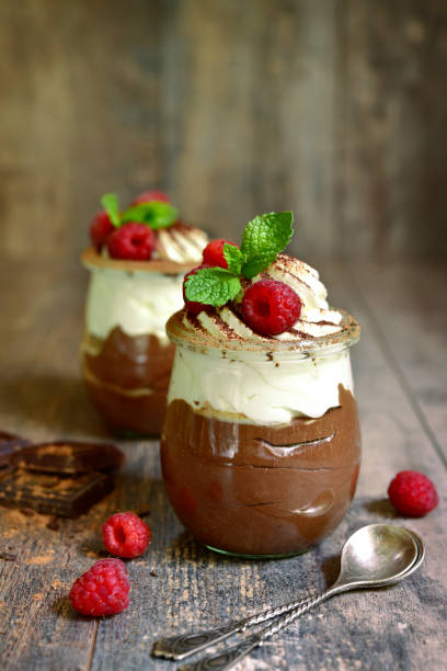 istock Chocolate mousse with whipped cream and fresh raspberry 992308586
