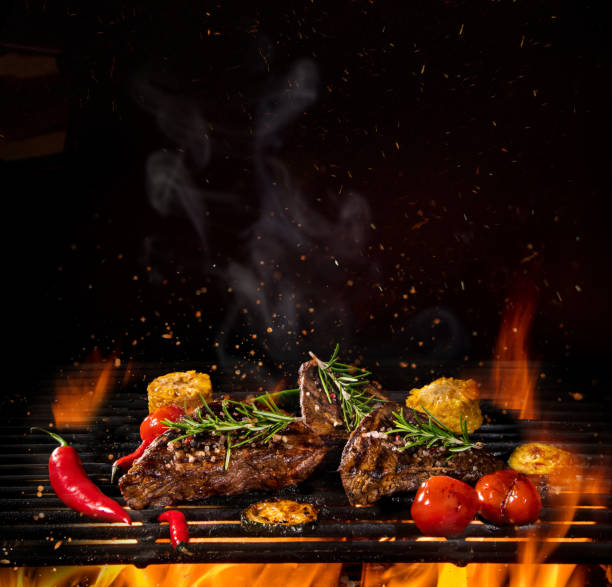 istock Beef steaks on the grill with flames 992316384