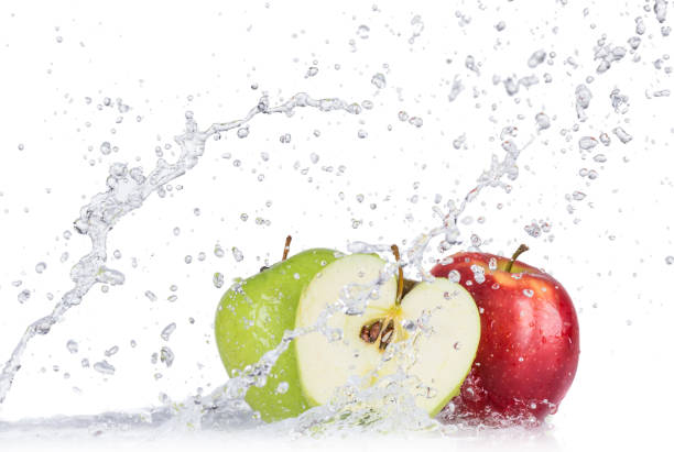istock Fresh apples with water splash over white background 992316938