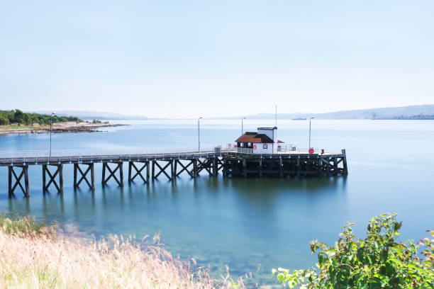 istock Kilcreggan pier old victorian structure in Argyll and Bute on the River Clyde during the summer 992334860