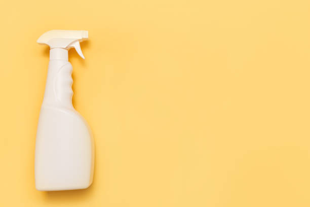 istock Simple white plastic hand spray bottle on yellow background 992342934