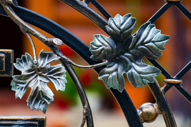istock wrought-iron gates, ornamental forging, forged elements close-up 992343882