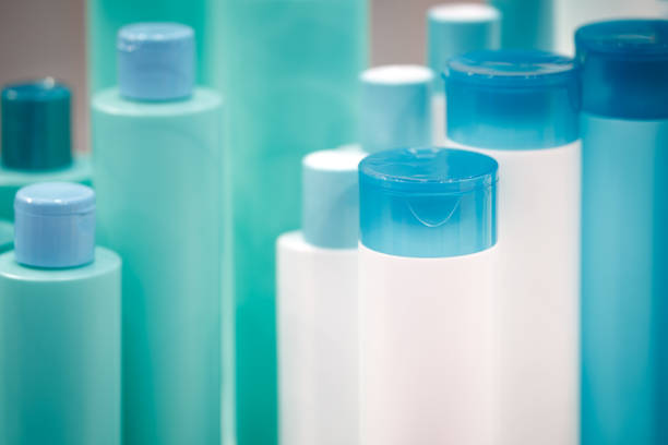 istock Several different close up of a white and turquoise blue designer plastic bottle for cosmetics and perfumery or for other liquids 992346874