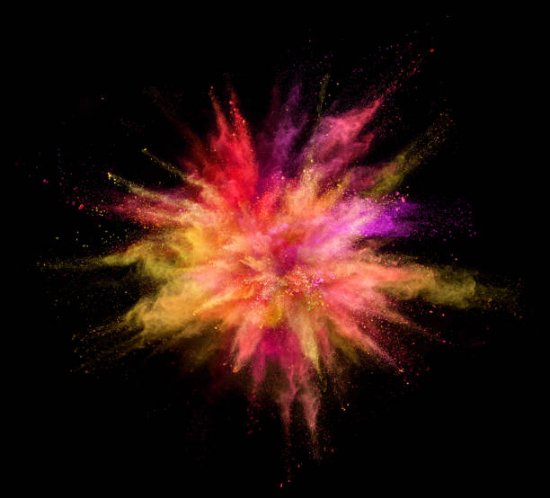 istock Explosion of coloured powder on black background 992347834