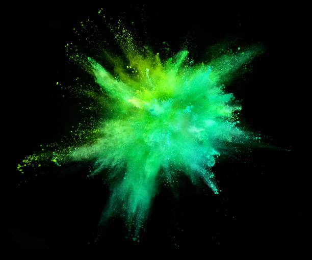 explosión de polvo de colores sobre fondo negro - verde color fotografías e imágenes de stock