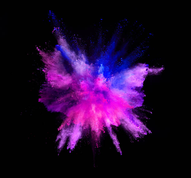 istock Explosion of coloured powder on black background 992348348