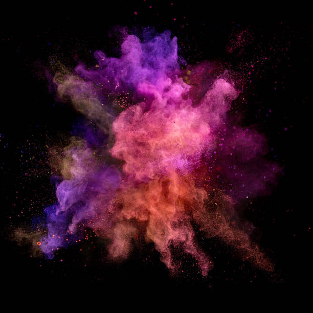 istock Explosion of coloured powder on black background 992350614