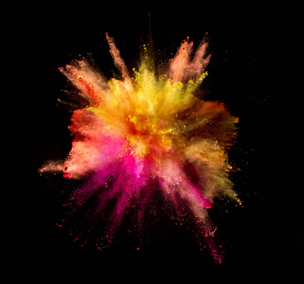 istock Explosion of coloured powder on black background 992350692
