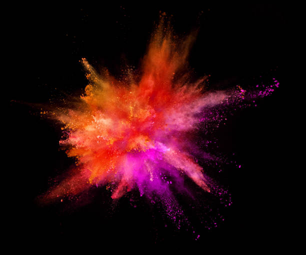 istock Explosion of coloured powder on black background 992350738