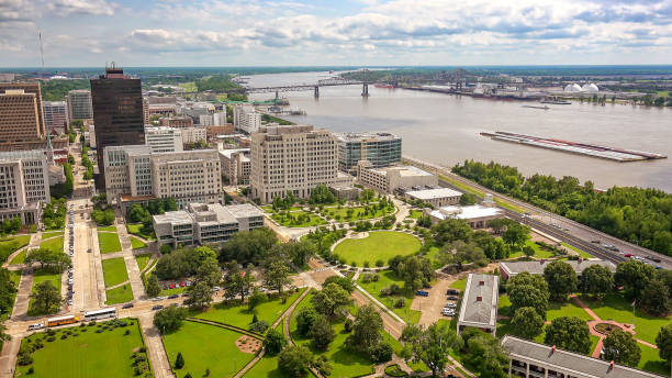 Baton Rouge City Skyline and Mississippi River in Louisiana Aerial view of Baton Rouge, Louisiana and the Mississippi River baton rouge stock pictures, royalty-free photos & images