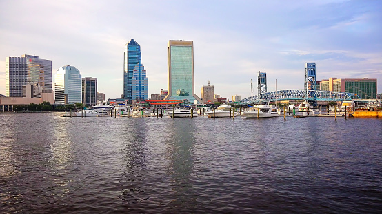 Jacksonville, Florida city skyline over the St. John's River (logos blurred for commercial use)