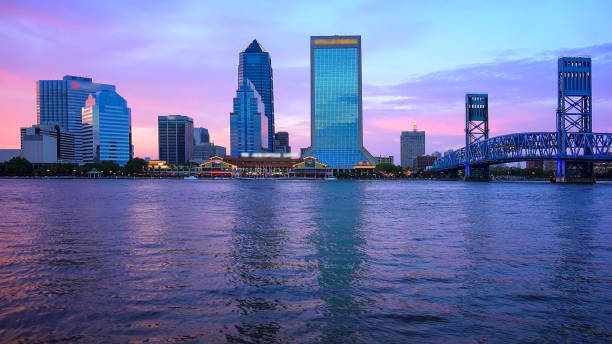 istock Jacksonville, Florida Skyline Over the St. John's River at Sunset (logos blurred) 992352556
