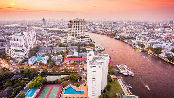 istock Bangkok Skyline and Chao Phraya River at Sunset in Thailand 992352748