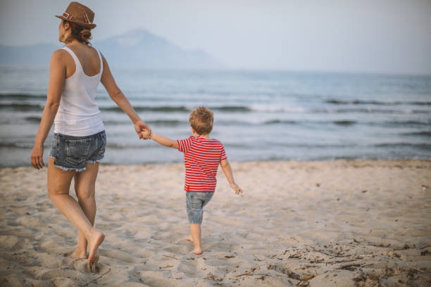 istock Mother and son at the beach 992353216