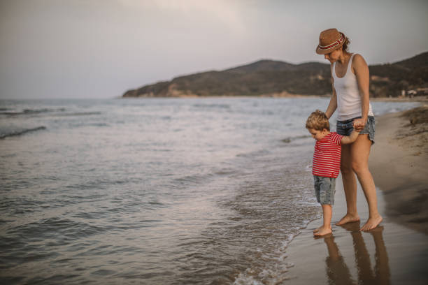 istock Mother and son at the beach 992357484