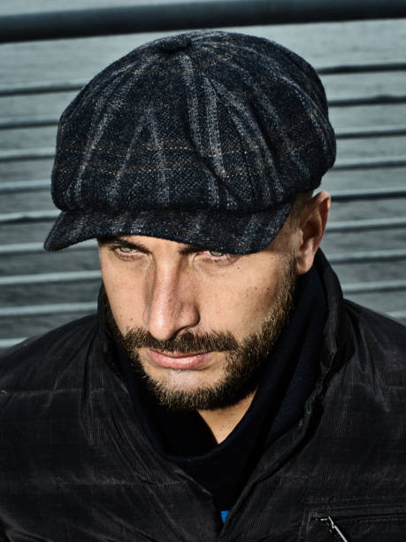 istock Brutal portrait of a man in a cap 992366518
