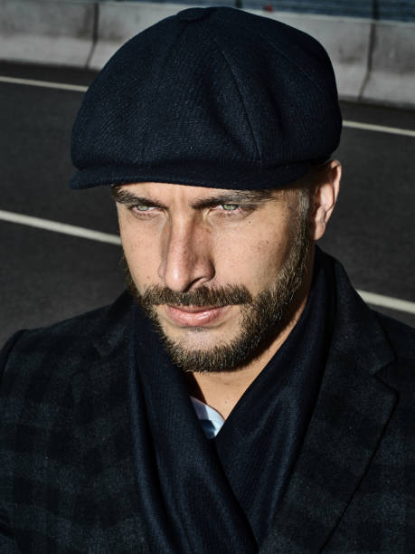 istock Brutal portrait of a man in a cap 992366608