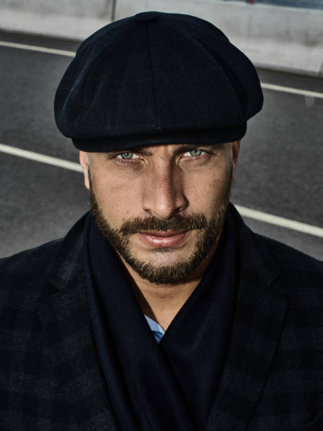 istock Brutal portrait of a man in a cap 992366656