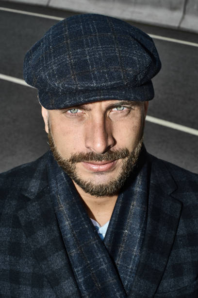 istock Brutal portrait of a man in a cap 992366700
