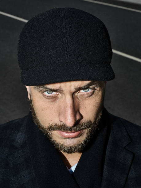 Brutal portrait of a man in a cap
