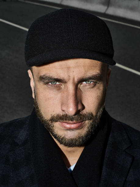 istock Brutal portrait of a man in a cap 992366780
