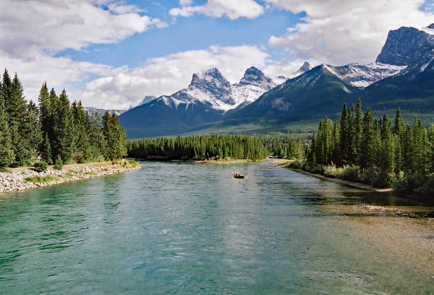 istock Bow River in Canmore with Three Sister Mountains 992394898