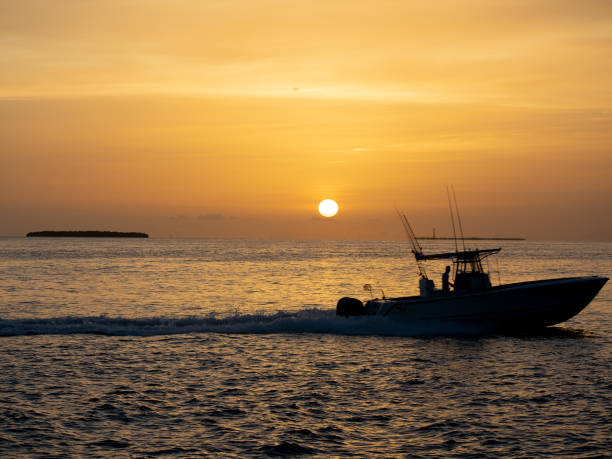istock Fishing Boat with Sunset as Background 992395532