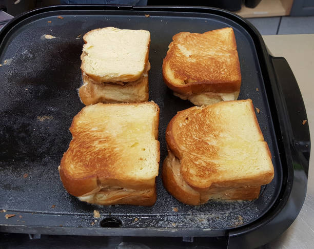 istock Grilled cheese sandwich grilling on a non-stick pan 992410956