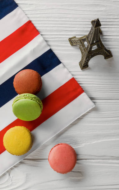 istock French Macarons and eiffel tower on french flag 992411528